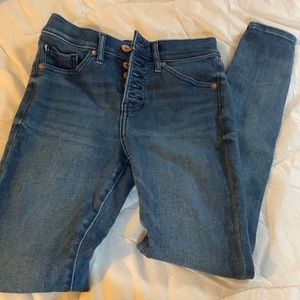Express button fly skinny jeans.